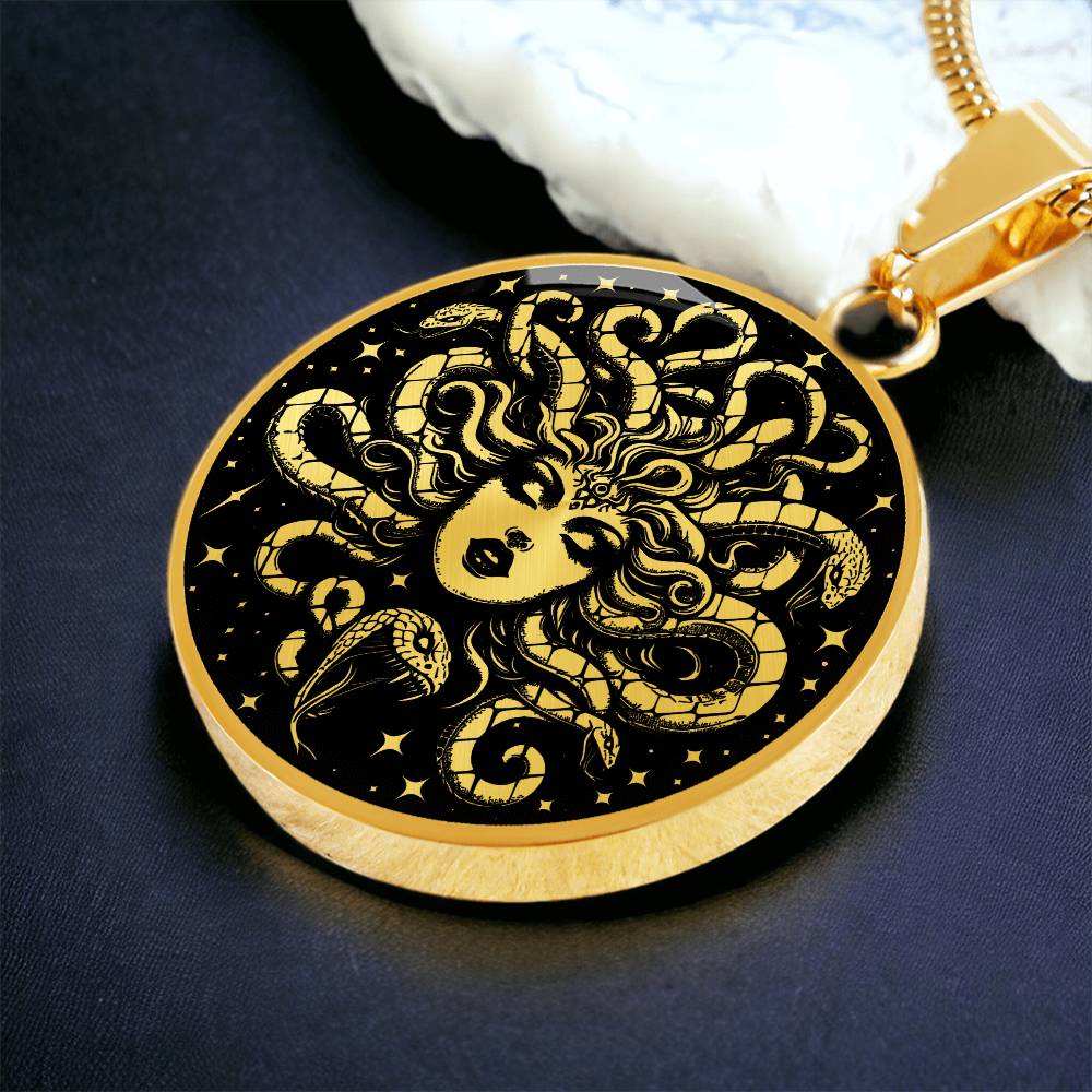 an Elegant gold pendant Medusa necklace with a Gold and Black background. This jewelry offers personalization with an engraving option for a name.