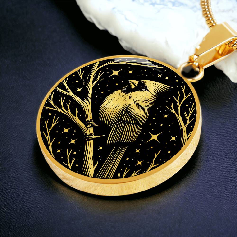 An Elegant gold pendant featuring a vivid gold Northern Cardinal Necklace with Stars and a tree Branch all in a gold and black backdrop. This jewelry offers personalization with an engraving option for a name.
