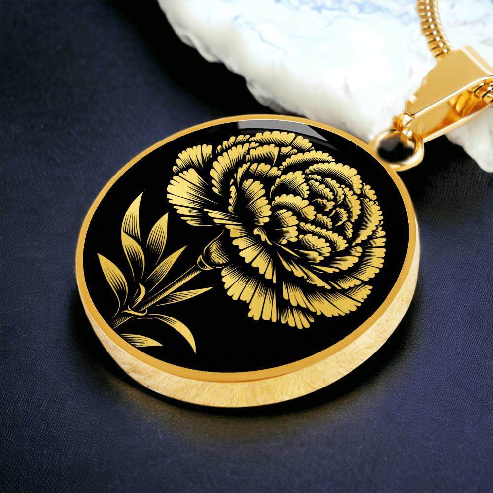 an Elegant January gold pendant Carnation Birth Flower necklace featuring a vivid gold flower, set against a black backdrop. This jewelry offers personalization with an engraving option for a name.