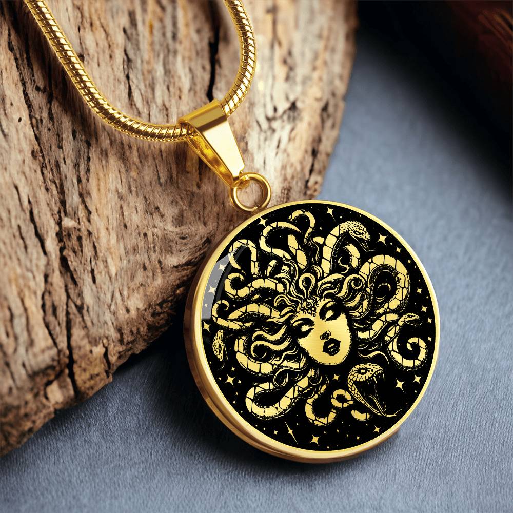 an Elegant gold pendant Medusa necklace with a Gold and Black background. This jewelry offers personalization with an engraving option for a name.