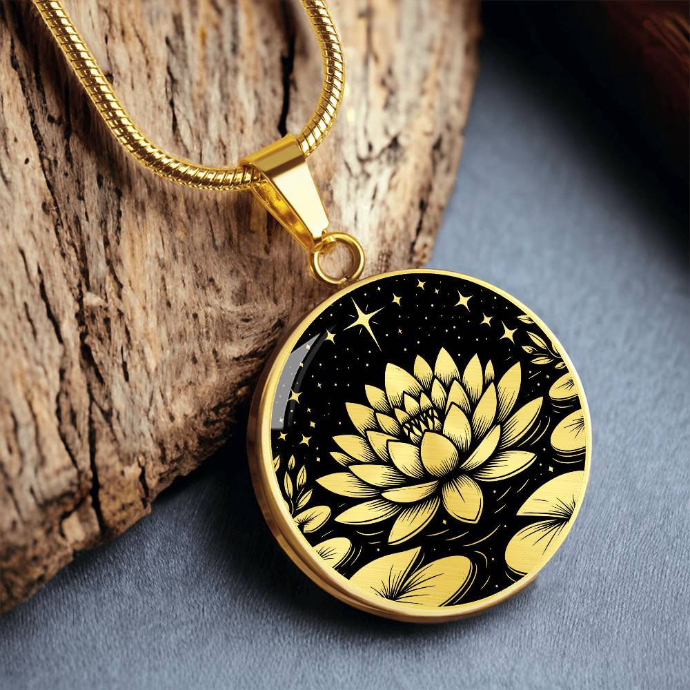 An Elegant gold pendant Water Lily Necklace featuring Stars, Lily Pads and a Water lily, all in black and gold. This jewelry offers personalization with an engraving option for a name.