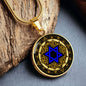 An Elegant gold pendant featuring a Vintage Design with a vivid blue Star of David Necklace, set against a gold and black backdrop. This jewelry offers personalization with an engraving option for a name.