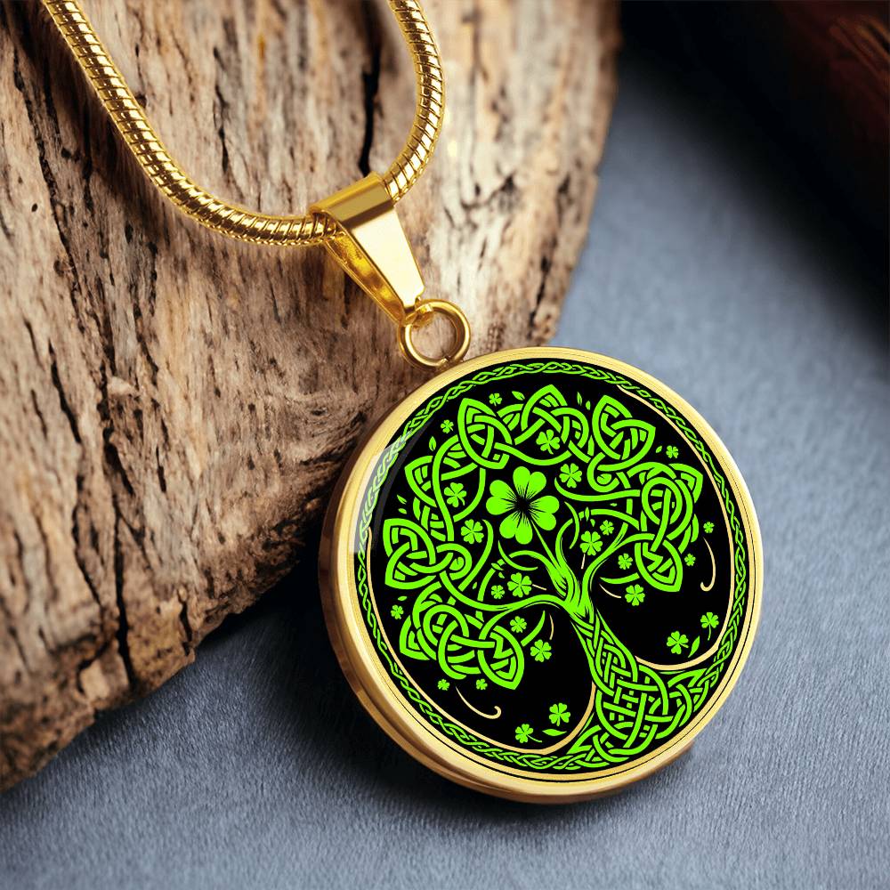 Elegant Gold pendant featuring a vivid Green Celtic four leaf Clover Tree of Life Necklace, set against a Black & gold backdrop. This jewelry offers personalization with an engraving option for a name.