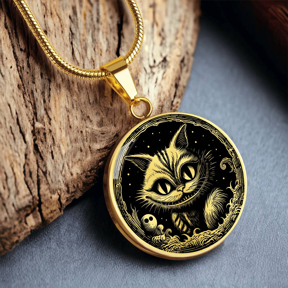 An elegant gold pendant Cheshire Cat Necklace. The colors are gold and black. This necklace offers personalization with an engraving option for a name.