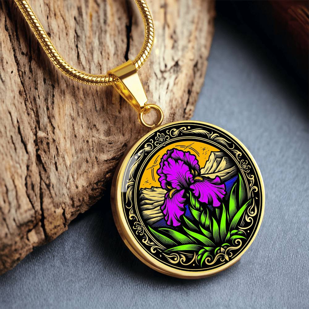 Februarys birth month flower Elegant gold pendant necklace featuring a vivid Purple Iris set against a sunset mountains with a river, the mountains are colored by the metal shinning through. This necklace offers personalization option for a name.