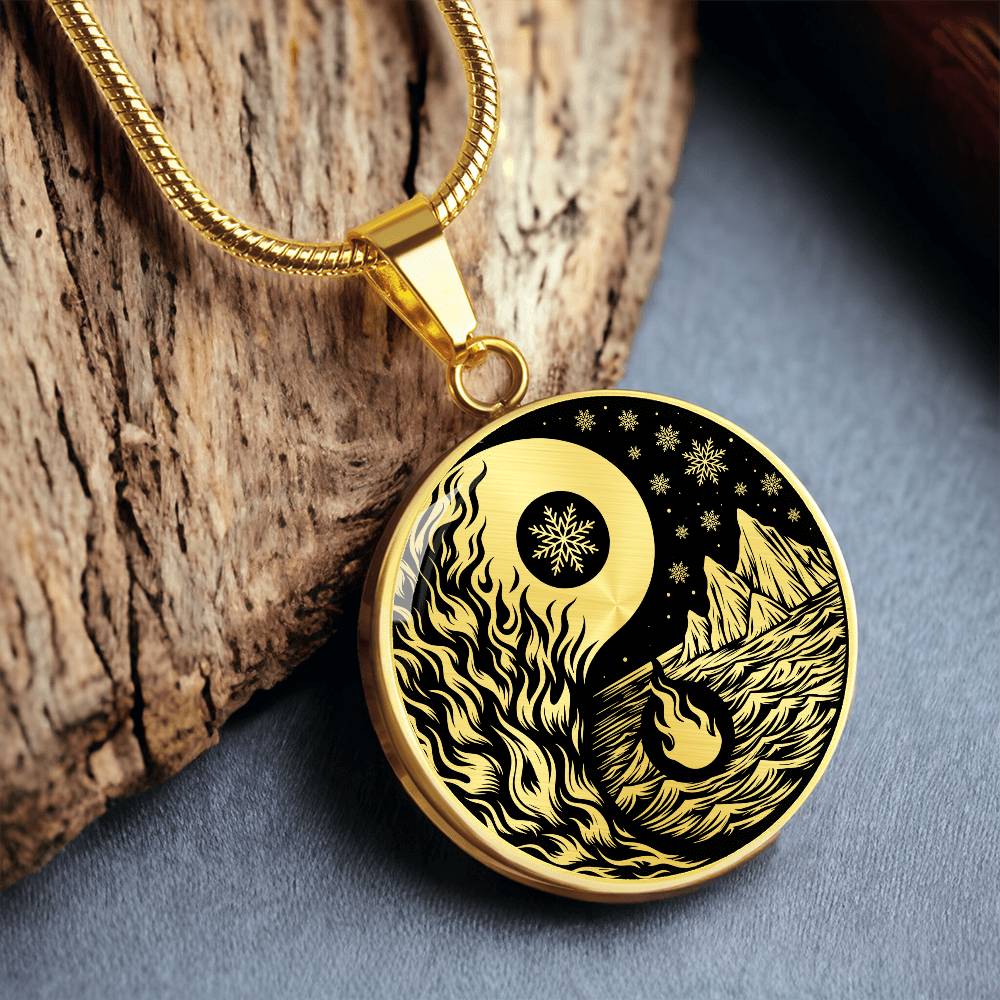 An Elegant gold pendant featuring a vivid Gold Fire, Water, snowflakes and Icebergs. set against a Black backdrop. This jewelry offers personalization with an engraving option for a name.