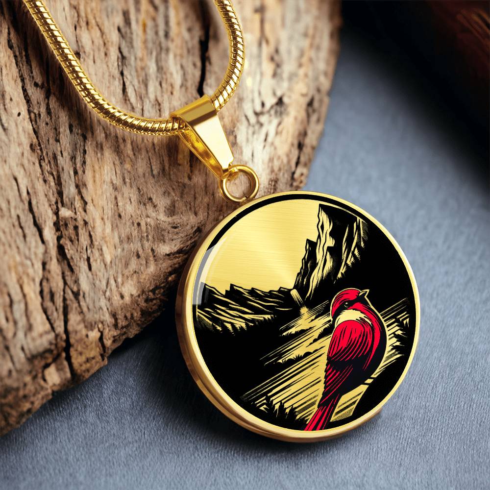 An elegant gold pendant Red Cardinal Necklace. The colors are gold, red and black. This jewelry offers personalization with an engraving option for a name.