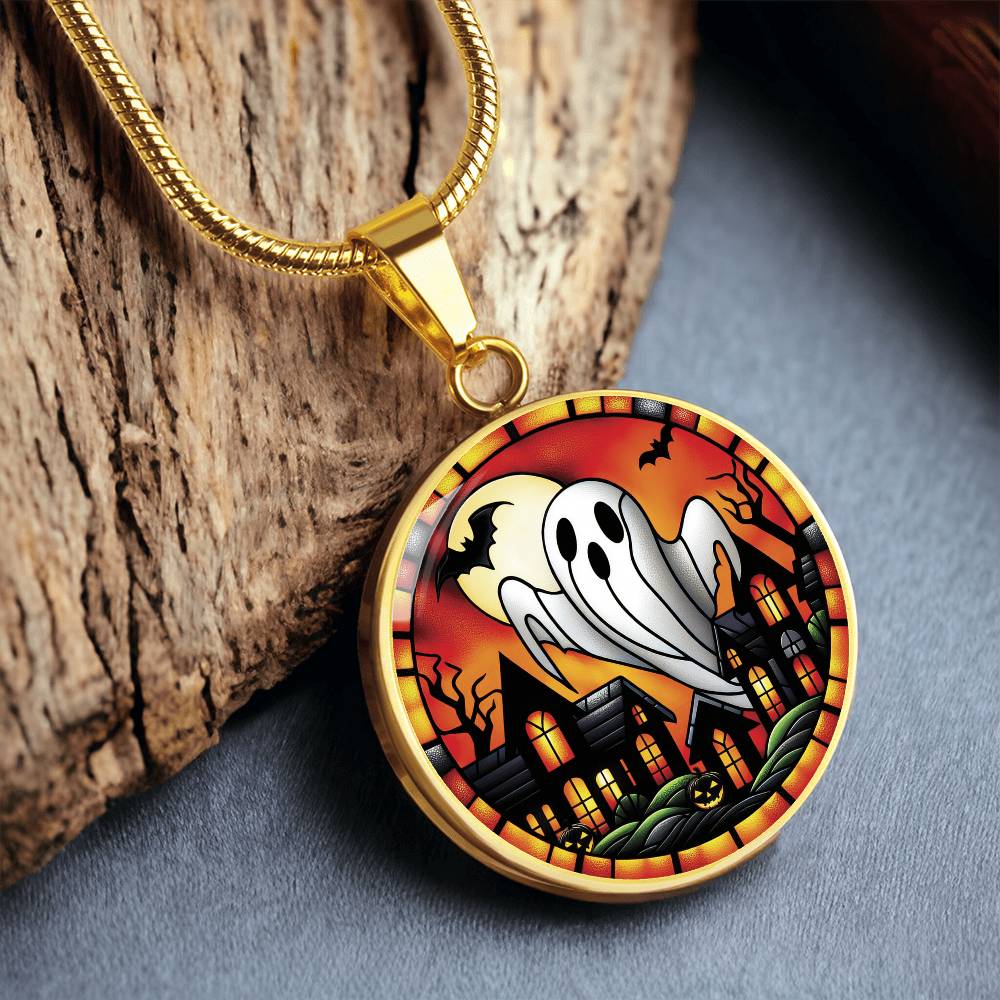 an elegant gold pendant Halloween Ghost Necklace. The colors are white, black, yellow, orange and green. This jewelry offers personalization with an engraving option for a name.