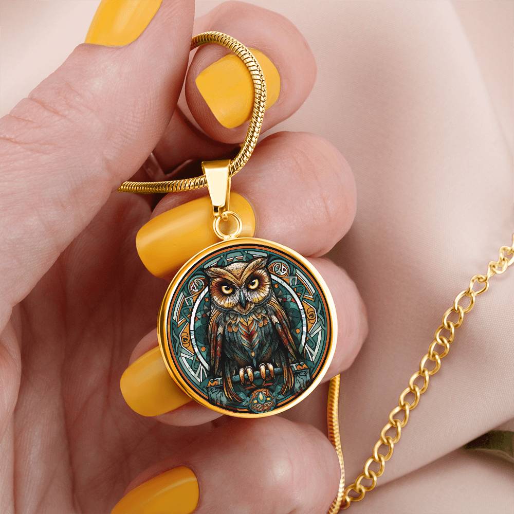 Woman holding an elegant gold pendant featuring a Celtic Owl Necklace, set against a Green and orange backdrop. This jewelry offers personalization with an engraving option for a name.