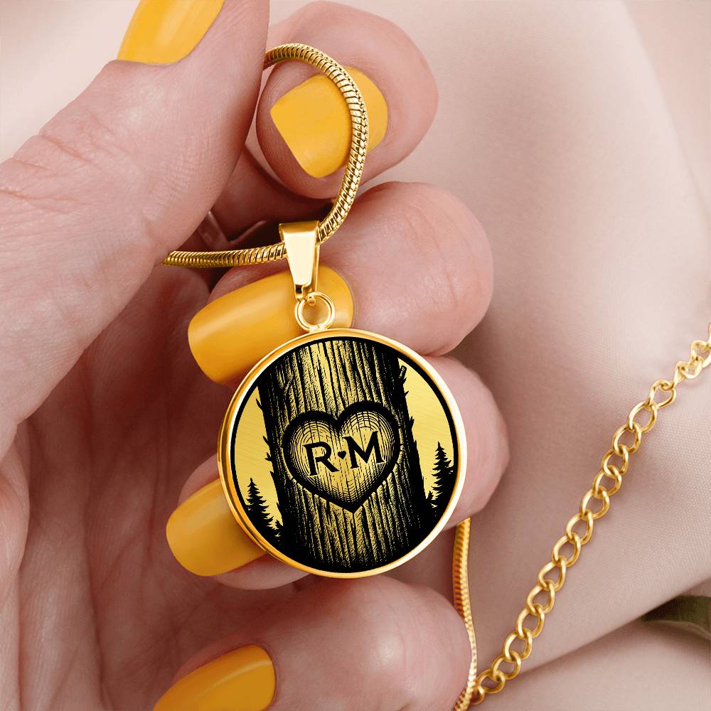 Woman holding an Elegant Gold pendant Love Heart initial necklace featuring a Heart engraved onto a pine tree, set against a Gold & black backdrop. This jewelry offers personalization with an engraving option for a name.