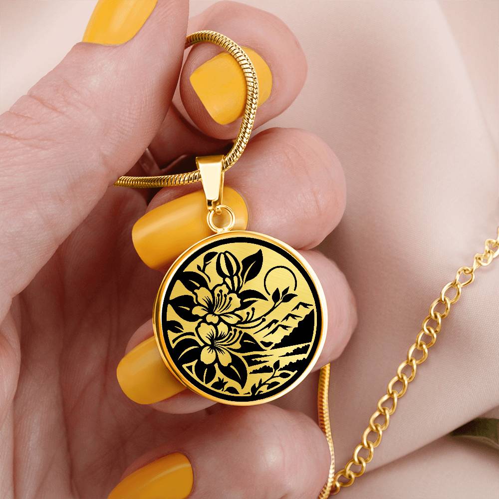 Woman holding an Elegant gold pendant featuring a honeysuckle, silhouette Junes birth month flower, set against a gold or silver backdrop. This necklace offers personalization with an engraving option for a name.