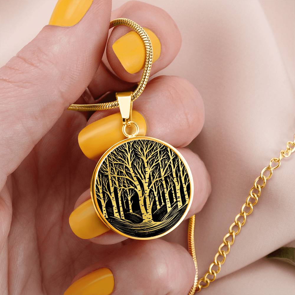Woman holding An Elegant gold pendant featuring a vivid gold Birch Tree Necklace, set against a Black backdrop. This jewelry offers personalization with an engraving option for a name.