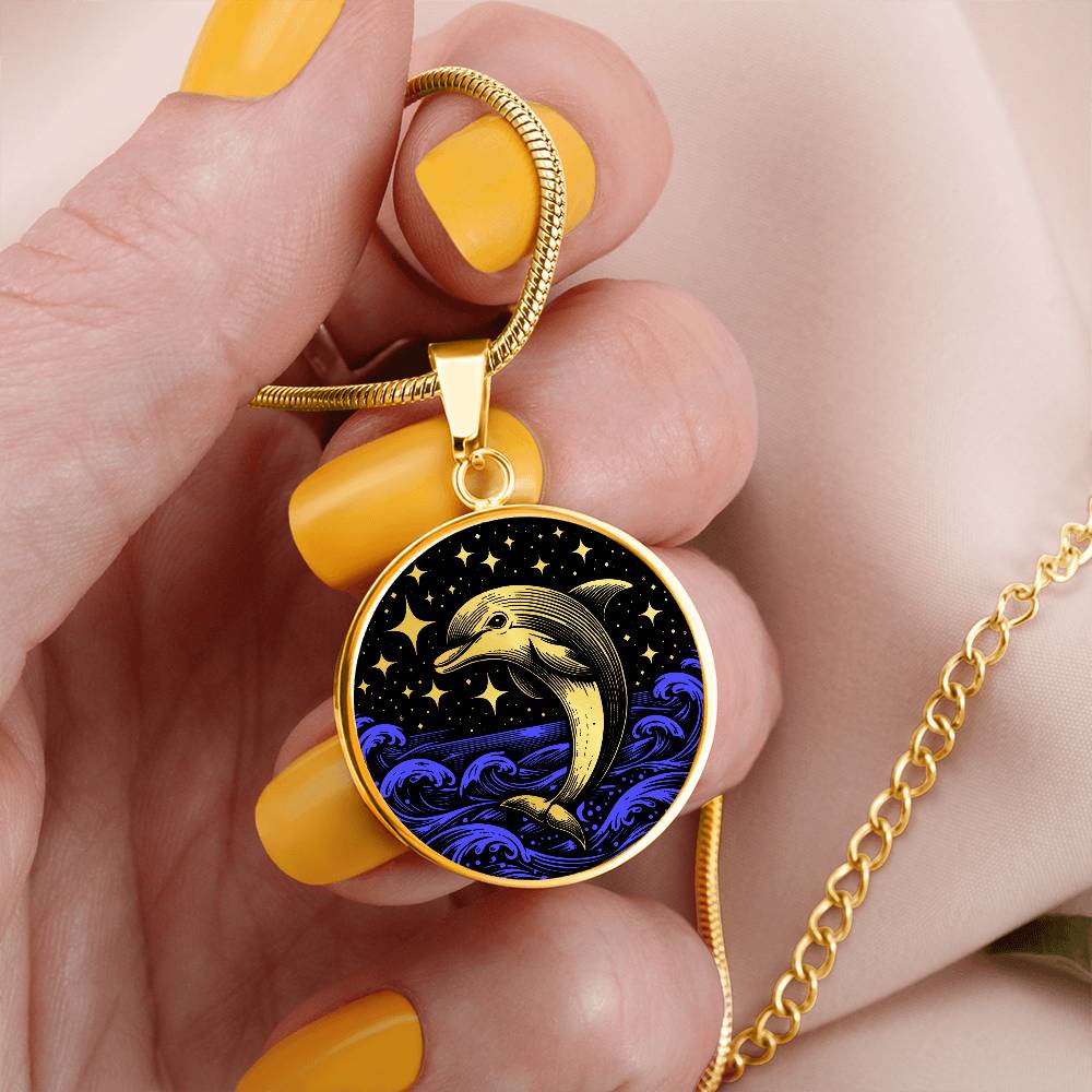 Woman holding an Elegant gold pendant featuring a vivid gold Dolphin Necklace with a Stars and Ocean Waves set against a gold and black backdrop. This jewelry offers personalization with an engraving option for a name.