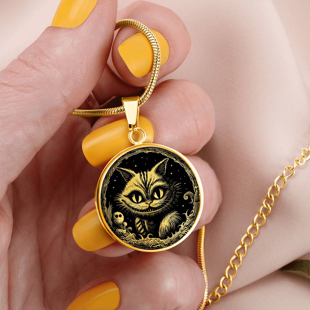 Woman holding an elegant gold pendant Cheshire Cat Necklace. The colors are gold and black. This necklace offers personalization with an engraving option for a name.