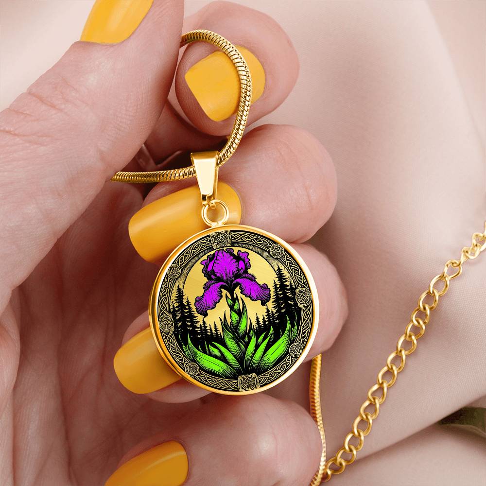 Woman holdings a Februarys birth month flower in an Elegant gold pendant necklace featuring a vivid Purple Iris with a gold sun or silver moon surrounded by a forest with a Celtic frame. This necklace offers personalization option for a name.