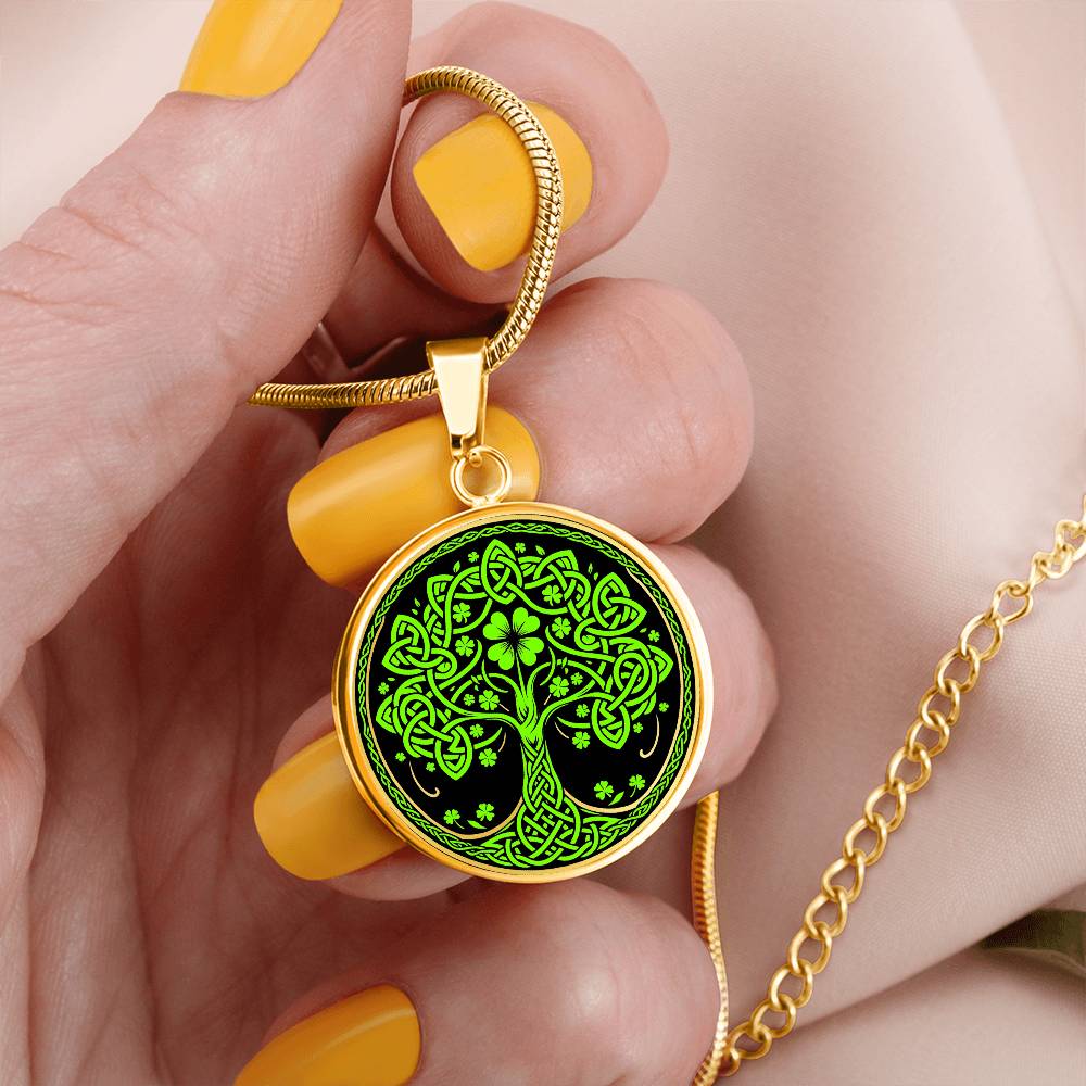 Woman holding an Elegant Gold pendant featuring a vivid Green Celtic four leaf Clover Tree of Life Necklace, set against a Black & gold backdrop. This jewelry offers personalization with an engraving option for a name.