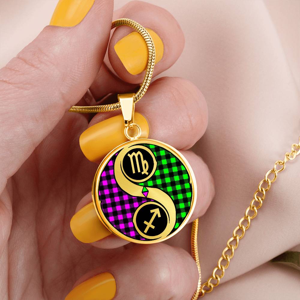 Woman holding an elegant gold pendant Zodiac Necklace. This jewelry offers personalization with an engraving option for a name.