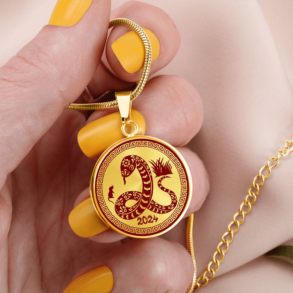 Woman holding a 2024 Gold Snake Necklace