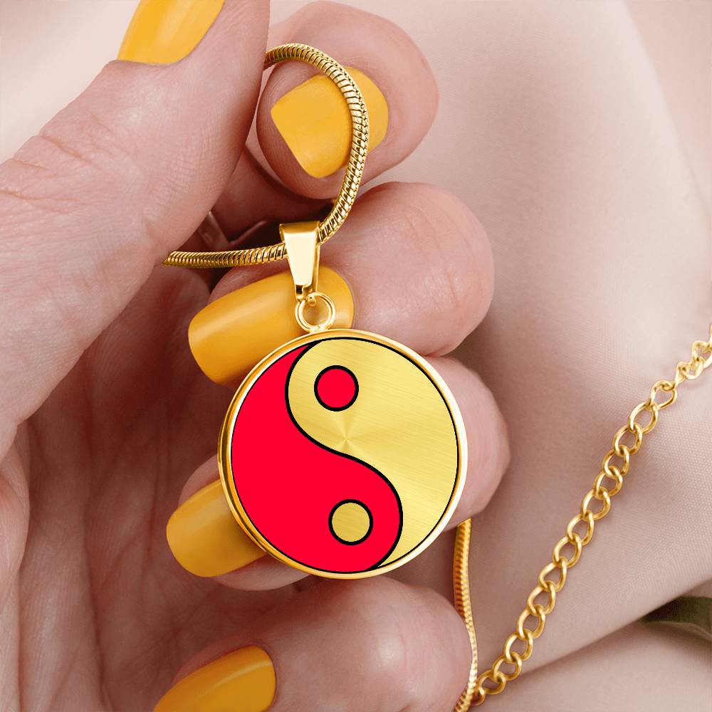 Woman holding a Gold Pendant Fire and Ice Yin Yang Necklace