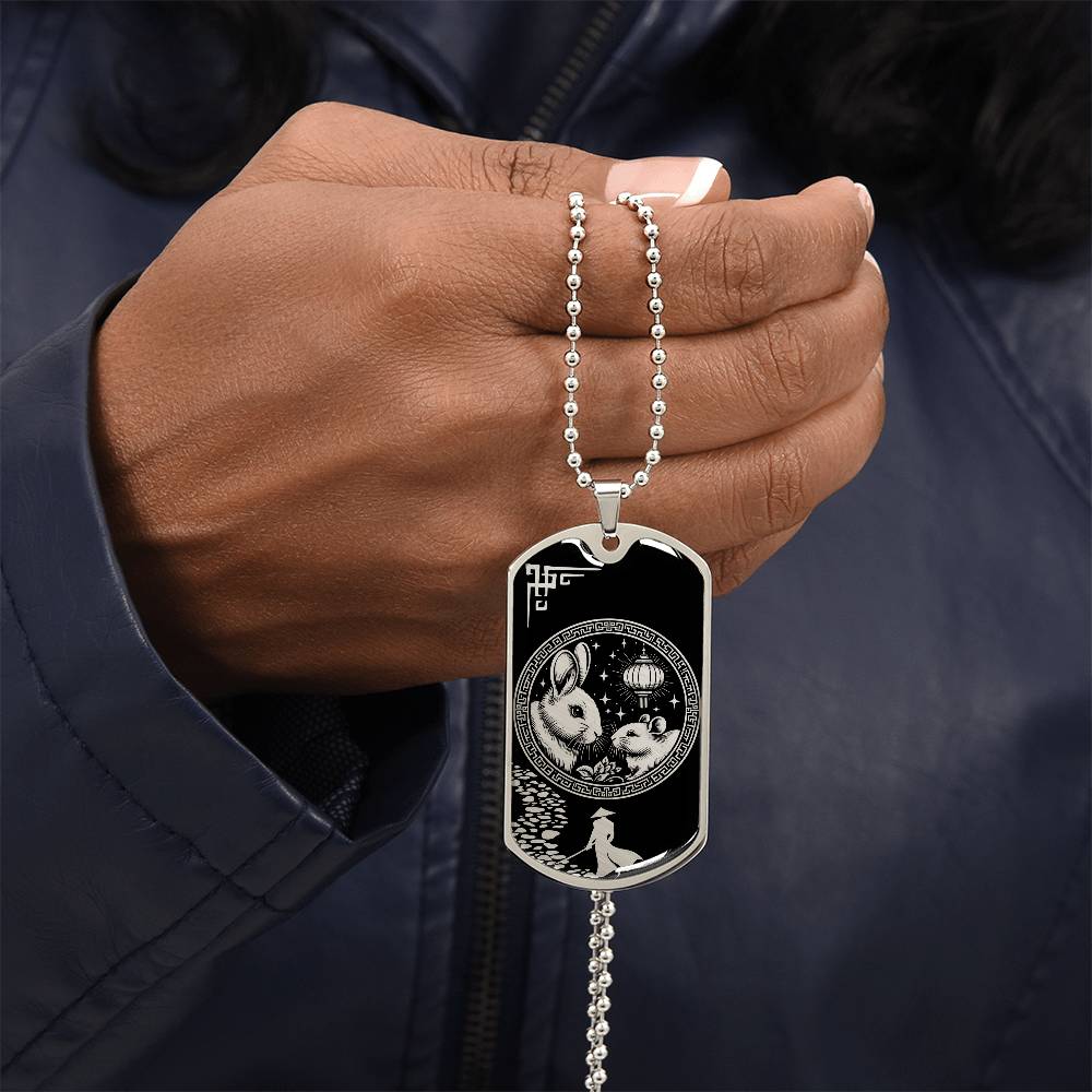 Man holding an elegant Silver pendant Rat and Year of The Rabbit Necklace. Colors are silver and black. This jewelry offers personalization with an engraving option for a name.