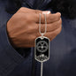 Man holding an elegant Silver pendant Viking Necklace. Colors are silver and black. This jewelry offers personalization with an engraving option for a name.