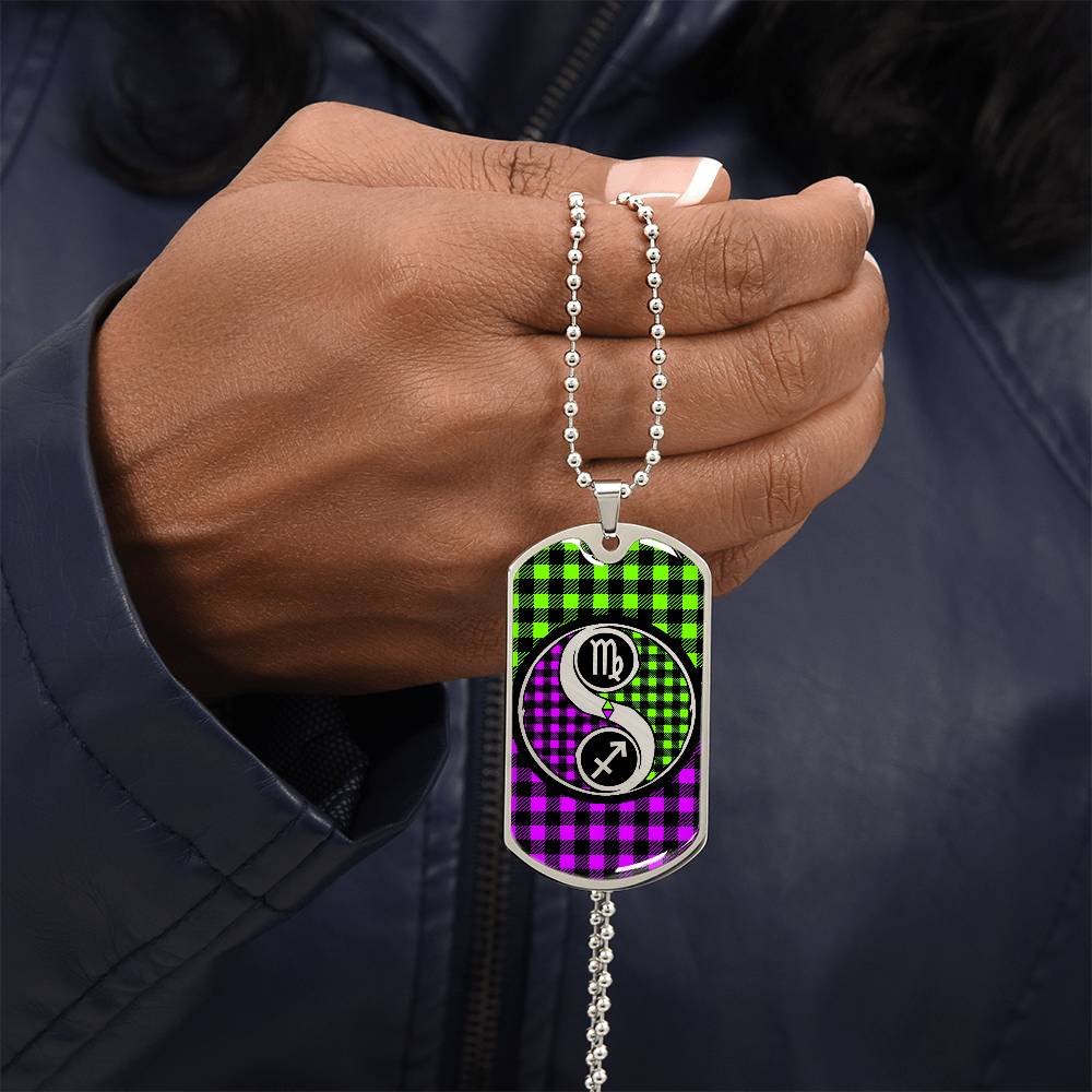 Man holding an elegant silver Dogtag pendant Zodiac Necklace. This jewelry offers personalization with an engraving option for a name.