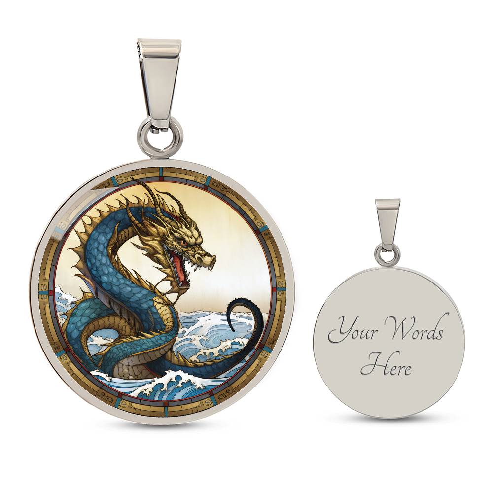 An Elegant silver pendant featuring a Water Dragon Necklace. Blue and yellow Dragon with a blue ocean, tan border and backdrop. This jewelry offers personalization with an engraving option for a name.