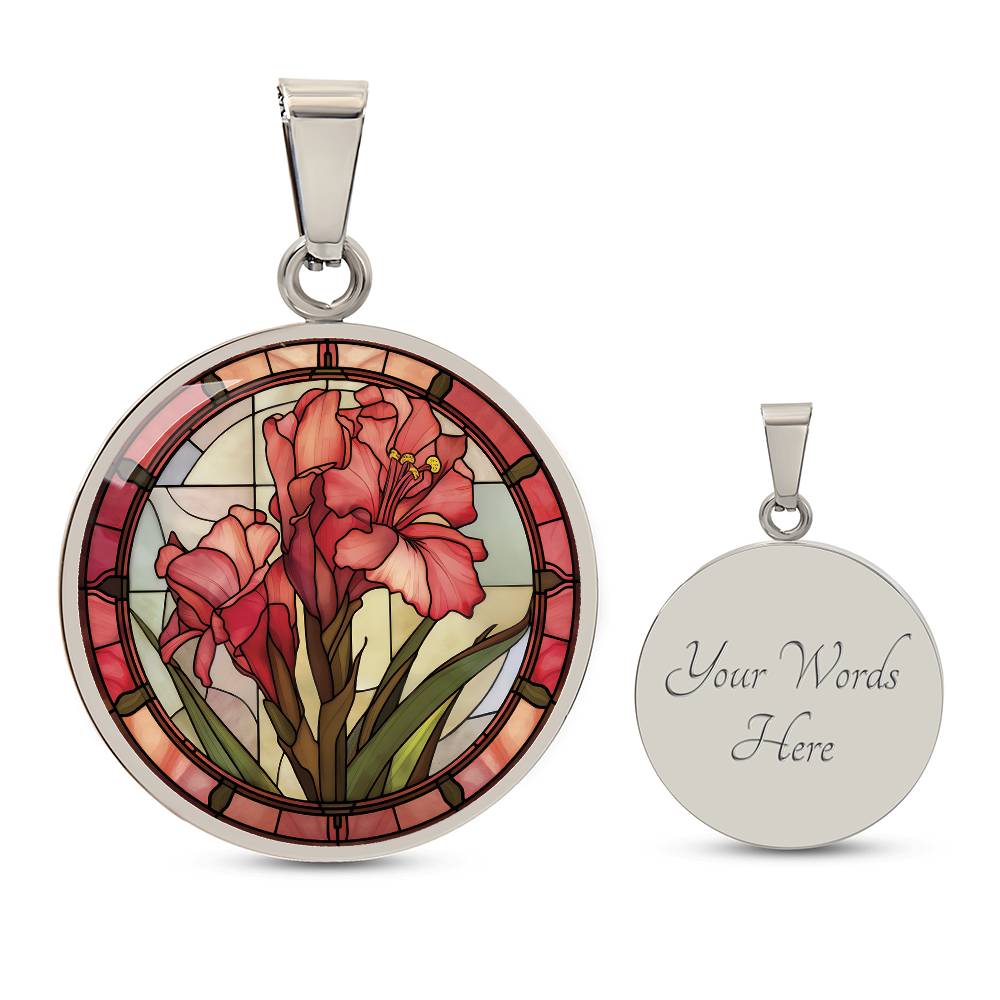 an elegant silver pendant Gladiolus Necklace. The colors are tan/green/blue/purple background, red and pink flowers, green grass, red border. This jewelry offers personalization with an engraving option for a name.