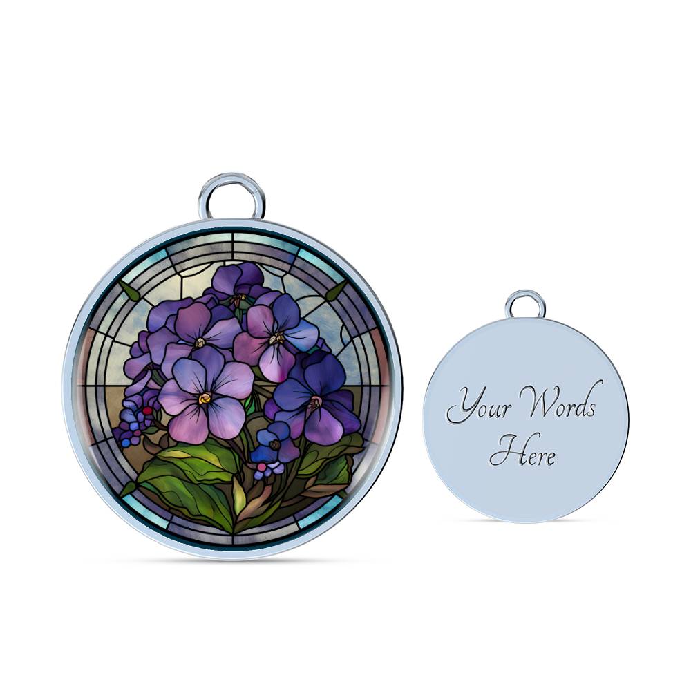 an Elegant silver pendant featuring a purple African Violet Birth Flower Bracelet, February&#39;s birth month flower, set against a blue and brown backdrop. This jewelry offers personalization with an engraving option for a name.