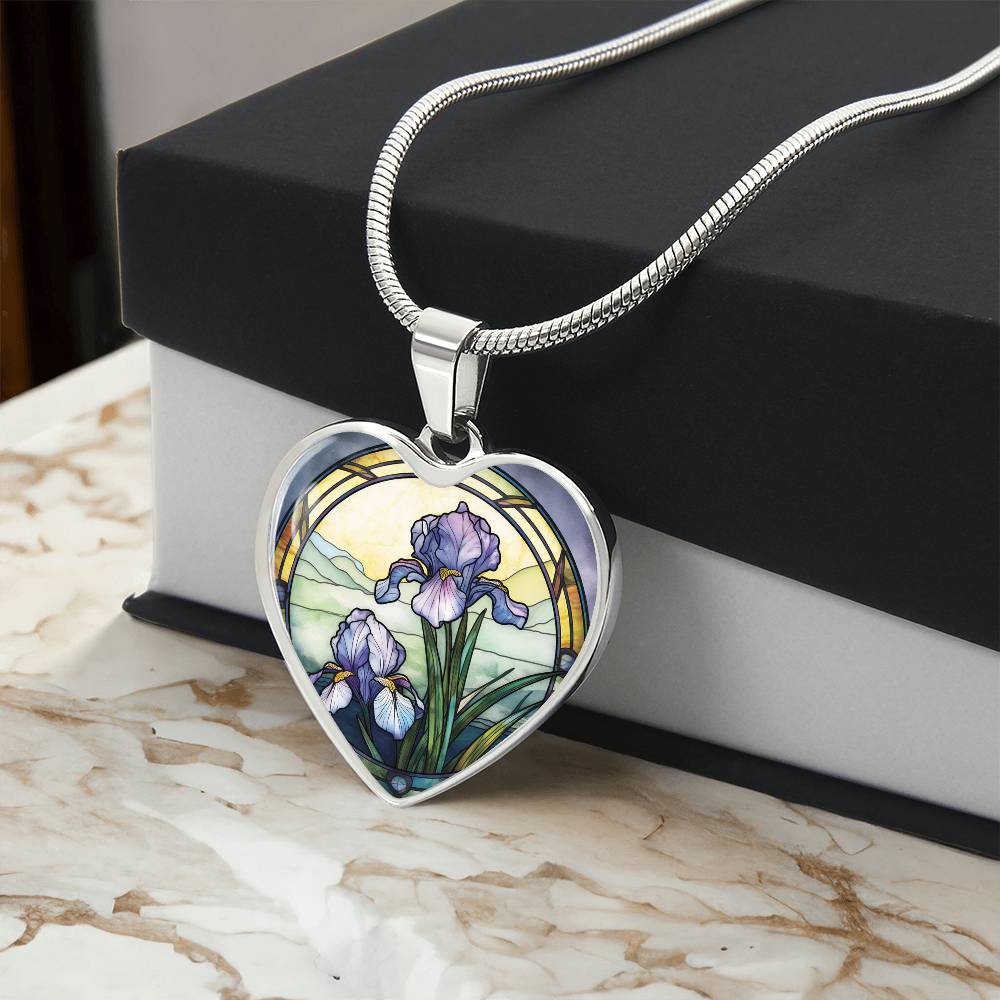 Gift box with a Silver Heart Pendant Purple Iris flower necklace, With green grass, a Yellow sunset and Green mountains. This necklace offers personalization option for a name.