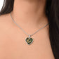 Woman wearing an Elegant silver pendant featuring a yellow/white Daffodil Birth Flower Necklace, March birth month flower, set against a Green & brown backdrop. This jewelry offers personalization with an engraving option for a name.