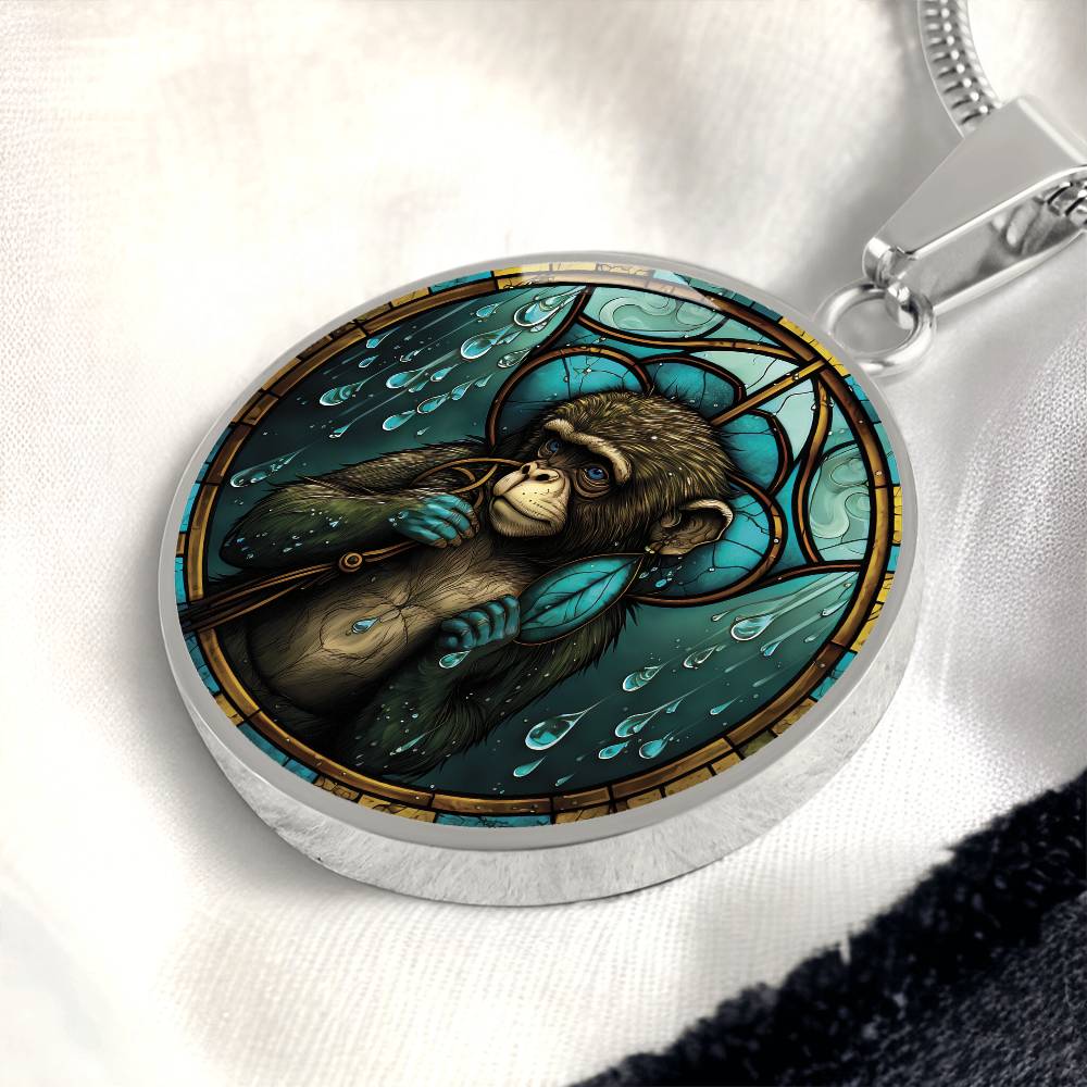 An elegant silver pendant Chinese Zodiac Monkey Necklace. The colors are yellow, blue, teal, brown and green. This jewelry offers personalization with an engraving option for a name.