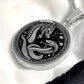 An Elegant silver pendant featuring a Year of the Snake and Year of The Dragon Necklace in silver and black. This jewelry offers personalization with an engraving option for a name.
