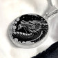 an Elegant silver pendant Chinese Dragon necklace featuring a vivid silver dragon with stars and clouds set against a black backdrop. This jewelry offers personalization with an engraving option for a name.