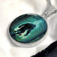 an Elegant silver pendant Bigfoot Necklace. Colors are Green, Brown, Black, Blue and White. This jewelry offers personalization with an engraving option for a name.