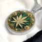 an Elegant silver pendant Weed Leaf necklace featuring a Green and Gold Marijuana Leaf. This jewelry offers personalization with an engraving option for a name.