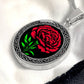 An elegant Celtic silver pendant  January Birth Flower Carnation necklace featuring a vivid red carnation, green stem and leaves, set against a silver & black backdrop. This jewelry offers personalization with an engraving option for a name.