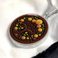 an elegant silver pendant Marigold Celtic Tree of Life Necklace. The Colors are yellow, green, brown and black. This jewelry offers personalization with an engraving option for a name.