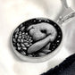 Elegant silver pendant Water Lily Bunny necklace. Colors are silver with a black background. This jewelry offers personalization with an engraving option for a name.