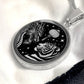 An Elegant silver pendant featuring a Year of the Tiger and Year of The Dragon Necklace in silver and black. This jewelry offers personalization with an engraving option for a name.