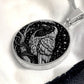 An elegant silver pendant Crow Necklace. The colors are gold and black. This jewelry offers personalization with an engraving option for a name.