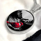 An elegant silver pendant Red Cardinal Necklace. The colors are silver, red and black. This jewelry offers personalization with an engraving option for a name.