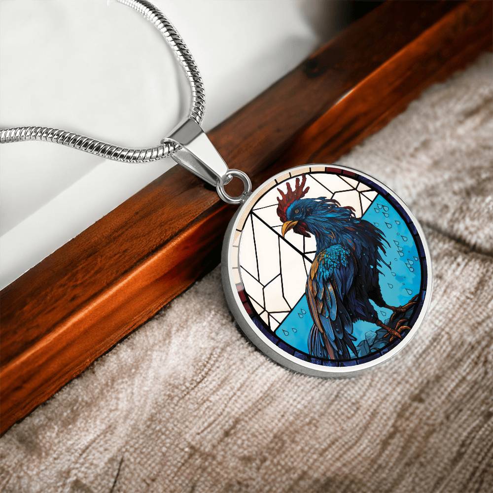 An Elegant silver pendant featuring a Chinese Zodiac Rooster Necklace. The colors are blue, white, tan, red, yellow, brown. This jewelry offers personalization with an engraving option for a name.