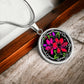 Elegant silver pendant featuring a vivid red, Pink & Purple honeysuckles, Junes birth month flower, set against a black backdrop with the metal shinning through. This necklace offers personalization with an engraving option for a name.