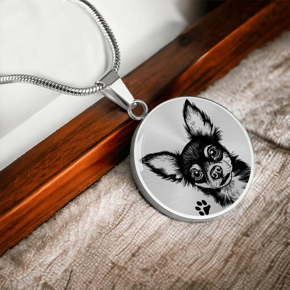 An Elegant silver pendant Chihuahua Dog Necklace. The Chihuahua Design is in Silver and Black with a black paw print. This jewelry offers personalization with an engraving option for a name.