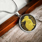 An Elegant silver pendant Rabbit Necklace. Yellow Rabbit and Flowers with a black and brown backdrop. This jewelry offers personalization with an engraving option for a name.
