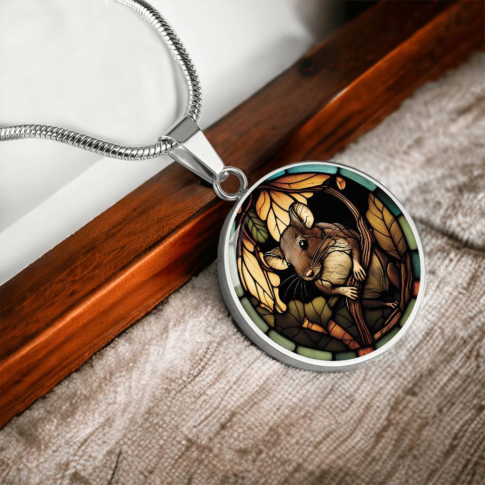 an Elegant silver pendant Rat necklace. Brown Rat, Brown Twigs, yellow and green leaves, blue, orange and green border. This jewelry offers personalization with an engraving option for a name.