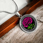 an Elegant January Silver pendant Celtic Carnation Birth Flower necklace featuring a vivid pink, green flower, set against a Silver & black backdrop. This jewelry offers personalization with an engraving option for a name.