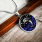 Elegant silver pendant featuring a vivid Silver Dolphin Necklace with a Stars and Ocean Waves set against a silver and black backdrop. This jewelry offers personalization with an engraving option for a name.