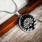 An Elegant silver pendant Water Lily Necklace featuring Stars, Lily Pads and a Water lily, all in black and silver. This jewelry offers personalization with an engraving option for a name.